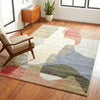 Tanami 336 rug with soft abstract shapes in beige, pink, blue, green, and red on a textured pile.