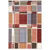 Multi-colored modern geometric patchwork rug with bold rectangular blocks in red, purple, orange, beige, and green tones.