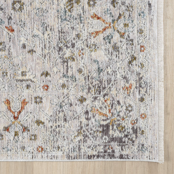 Patterned rug with floral design on a wooden floor