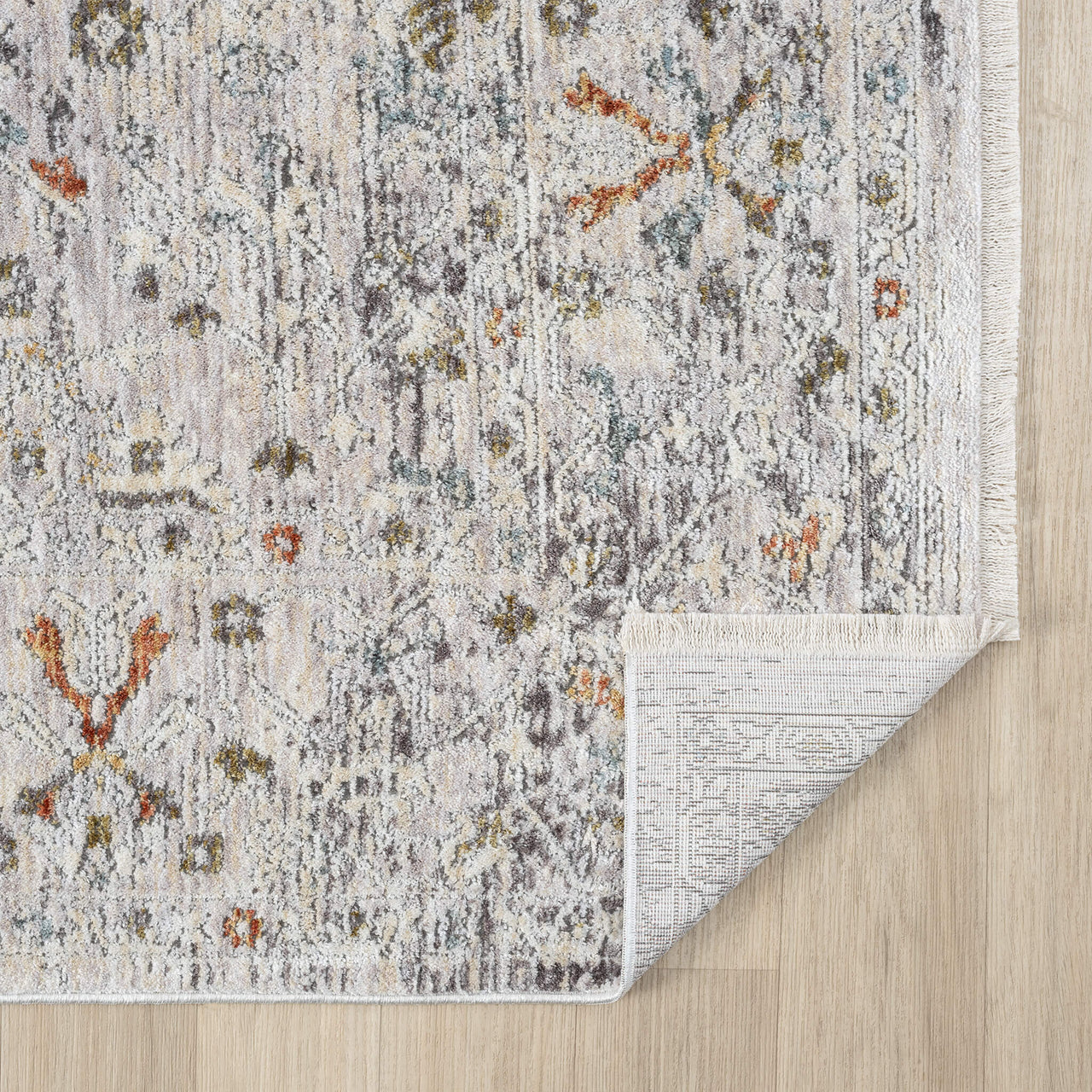 Patterned rug on a wooden floor