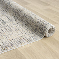 Rolled-up textured rug on a wooden floor