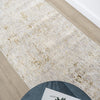 Textured beige rug on a wooden floor.