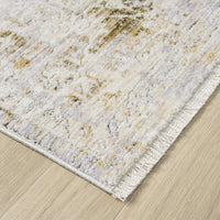 Textured area rug with a neutral color palette on a wooden floor.