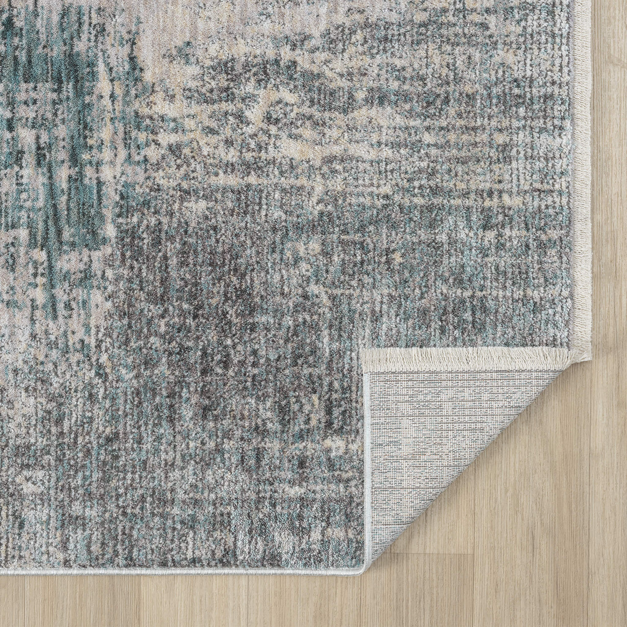 Textured area rug with a pattern on a wooden floor