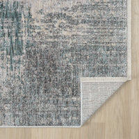 Textured area rug with a pattern on a wooden floor