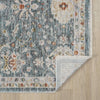 Blue floral patterned transitional runner rug with distressed vintage design and subtle beige border on wood floor.