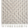 Grey geometric textured rug with raised rectangular patterns and white tassels on one edge.