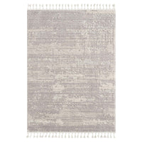 Grey geometric textured modern rug with subtle abstract pattern and white tassels on short edges.