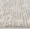 Light grey modern rug with geometric textured pile and subtle raised patterns.