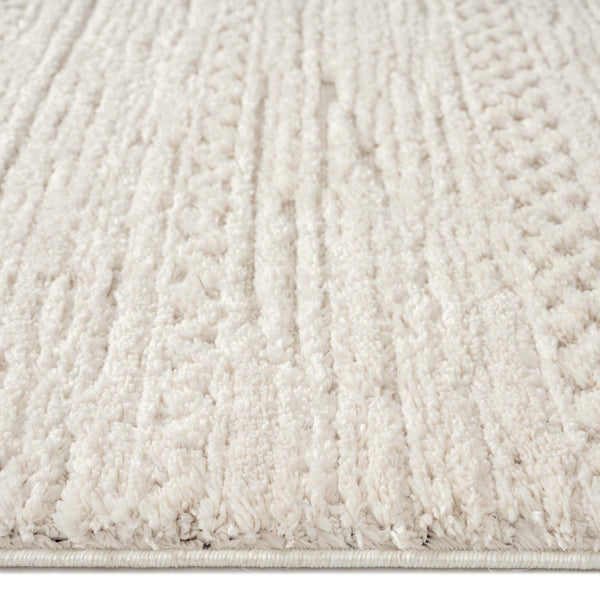 Beige runner rug with raised geometric textured pile and subtle linear patterns.