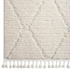 Beige geometric textured runner rug with diamond pattern and white tassels on edges.