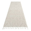 Beige runner rug with geometric diamond pattern, textured pile, and tasseled edges.