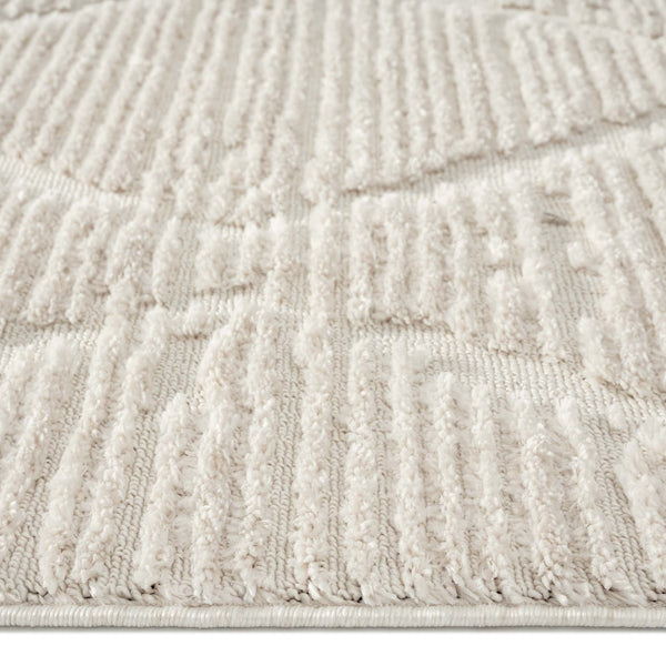 Beige runner rug with raised geometric textured pattern and soft pile.