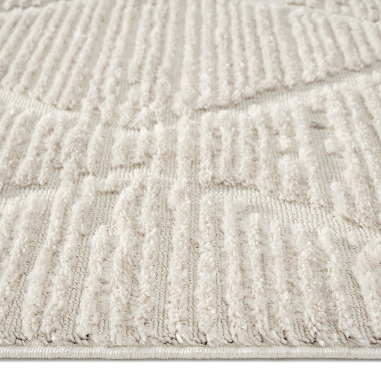 Beige runner rug with raised geometric textured pattern and soft pile.