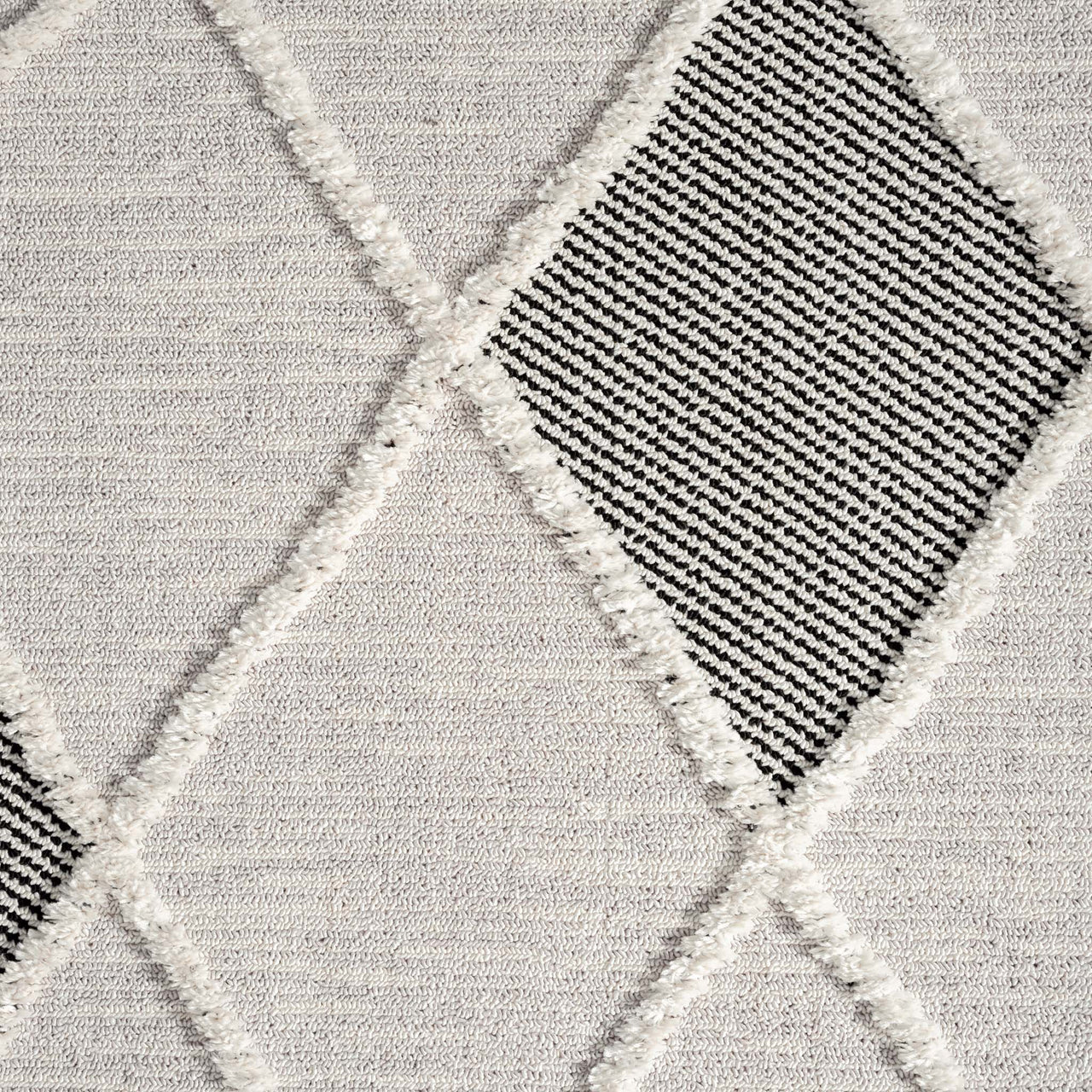 Grey runner rug with textured diamond pattern and contrasting black striped diamond shapes.