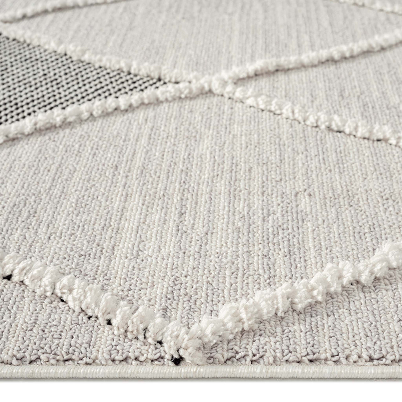 Grey runner rug with raised diamond geometric textured pattern and a soft woven pile.