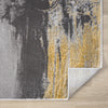 Grey and yellow abstract pattern modern runner rug with folded corner showing white backing.