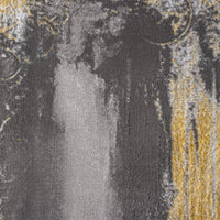 Grey and mustard yellow abstract patterned modern rug with textured polyester weave.