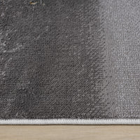 Grey gradient modern rug with subtle tonal variations and a low-pile texture.