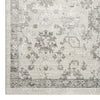 Cream and grey patterned runner rug with distressed vintage style and geometric motifs.