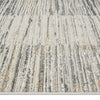 Light neutral modern rug with textured vertical striped pattern in beige, gray, and cream tones.