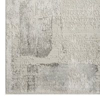 Modern runner rug with abstract neutral tones and textured light gray pattern.