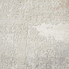 Light neutral runner rug with abstract textured pattern and subtle tonal variations.