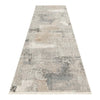 Neutral-toned abstract patterned runner rug with textured light gray, beige, and cream design.