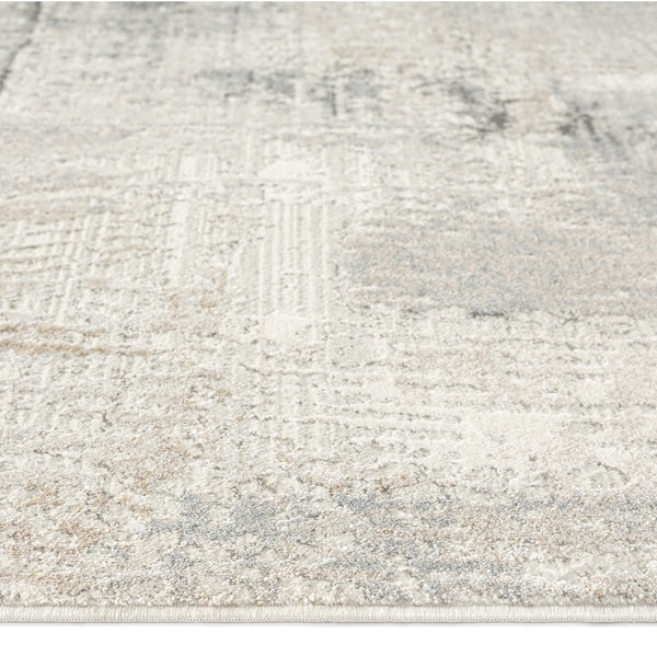 Modern runner rug with abstract neutral pattern in shades of beige, cream, and light gray.