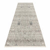 Long neutral-toned runner rug with intricate modern floral and geometric patterns in soft grays and beiges.