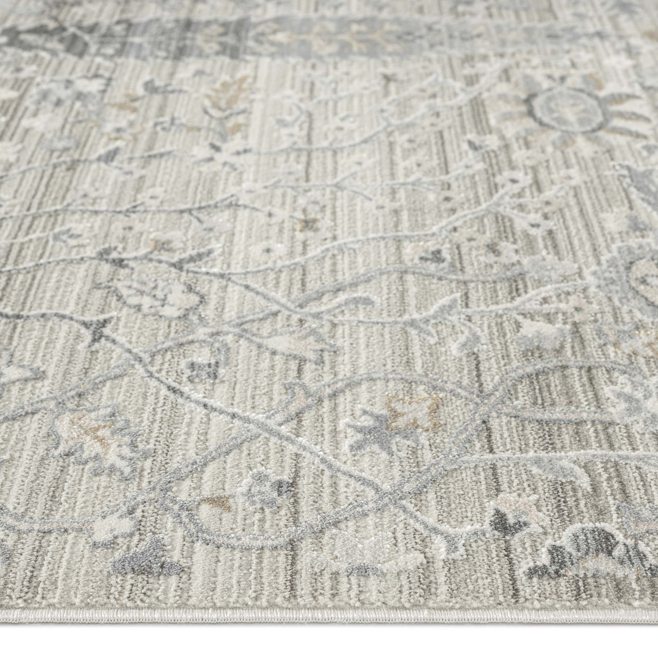 Neutral-toned runner rug with delicate floral and geometric patterns in beige and gray tones.