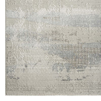 Neutral-toned modern runner rug with textured abstract pattern in beige and gray hues.