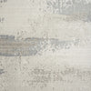 Light neutral runner rug with abstract modern pattern in shades of gray and beige, flat woven texture.