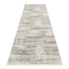 Neutral-toned modern runner rug with abstract light gray and beige pattern.