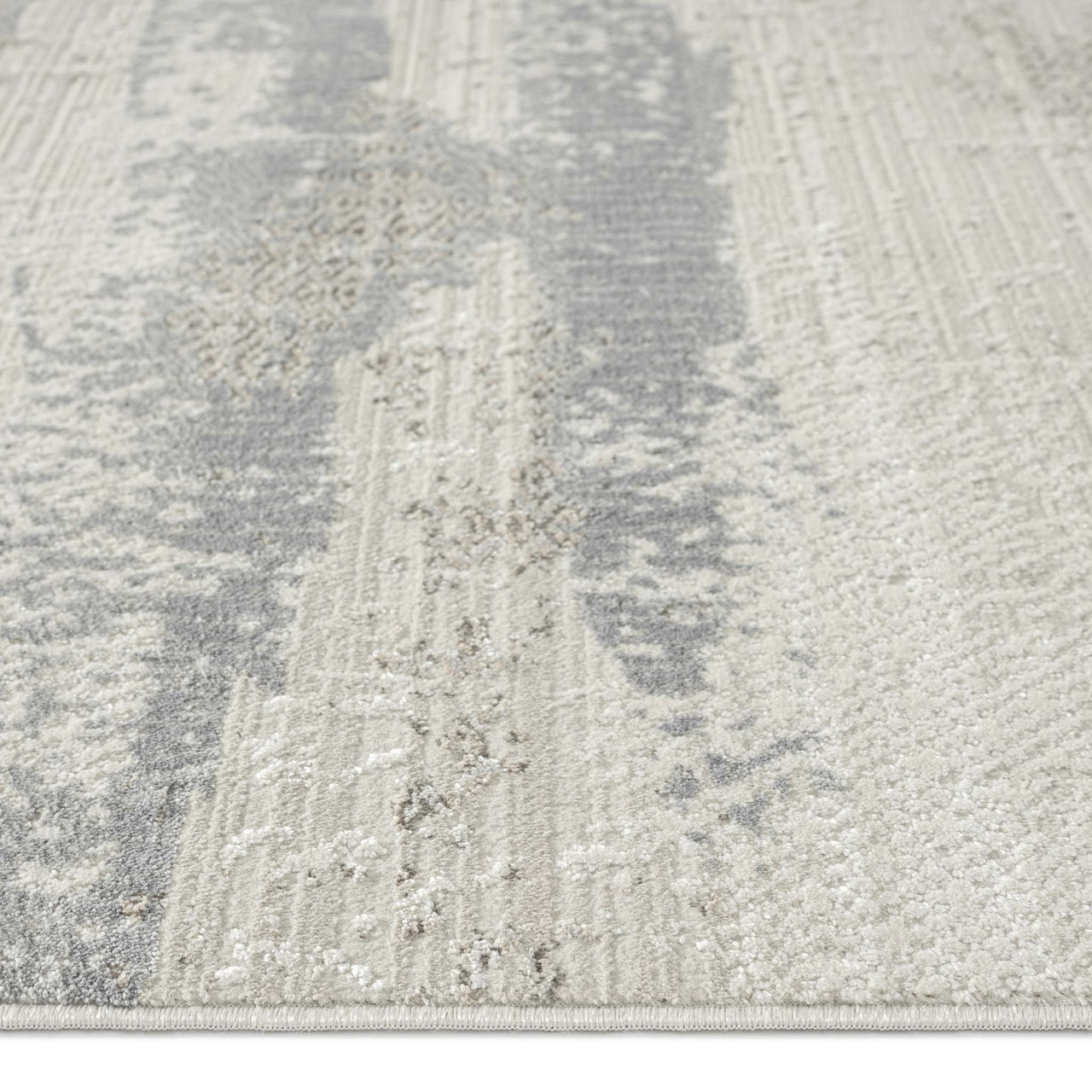 Neutral-toned runner rug with textured modern abstract pattern in soft gray and beige hues.
