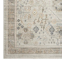 Rectangular modern rug with neutral tones and intricate geometric and floral patterns in beige, gray, and light brown.