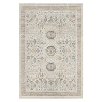 Light neutral rug with intricate modern geometric and floral patterns in beige and gray tones.