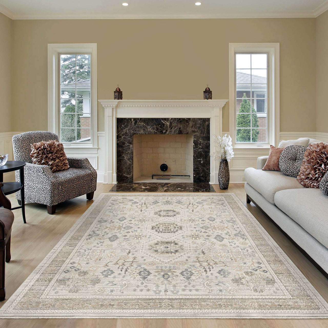 Light neutral patterned rug with intricate medallion design in a modern living room setting.