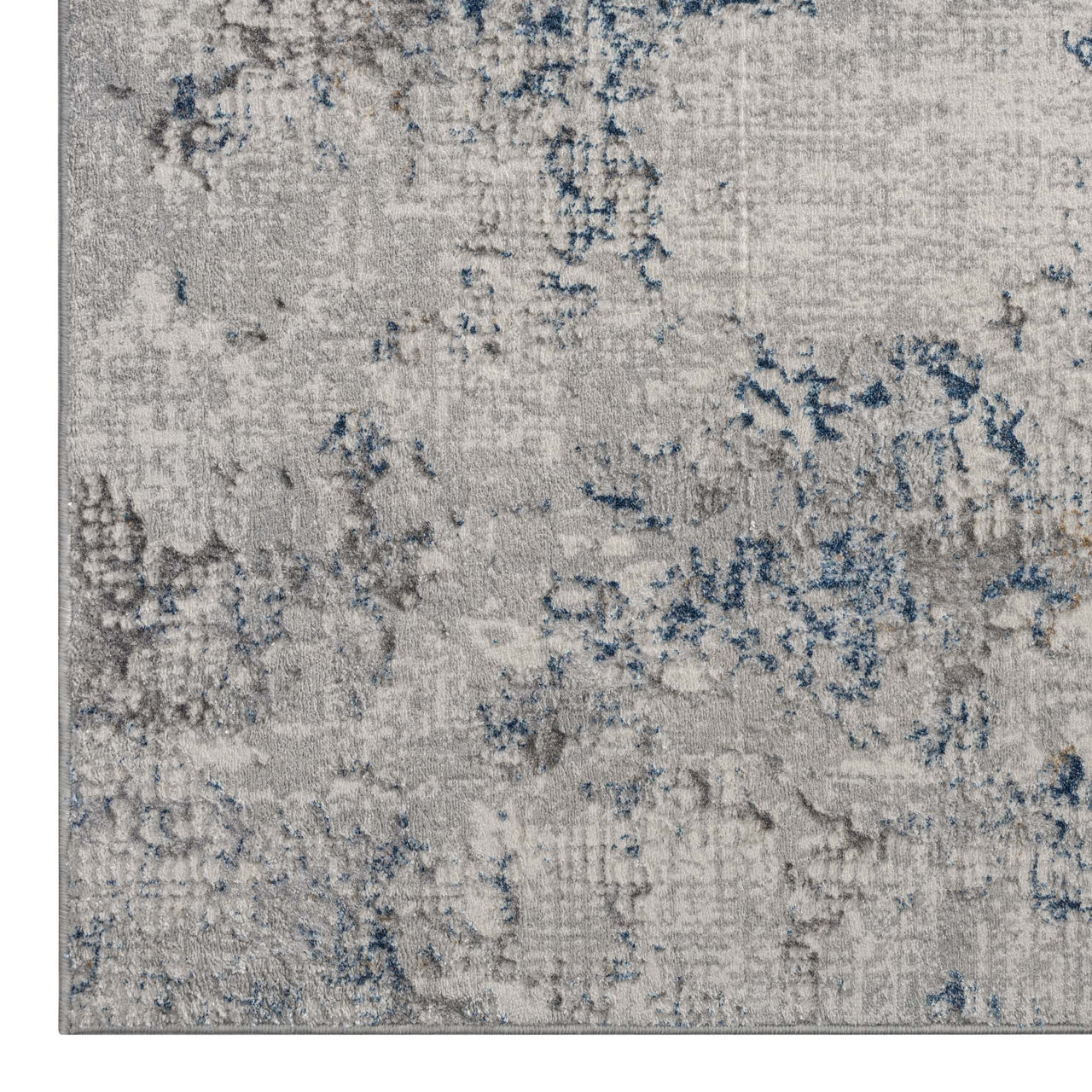 Modern runner rug with textured grey base and scattered blue and dark grey abstract patterns.