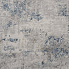 Grey and blue multi-color patterned modern rug with distressed textured design.