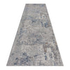 Grey and blue abstract patterned modern runner rug with textured low-shed polyester fibers.
