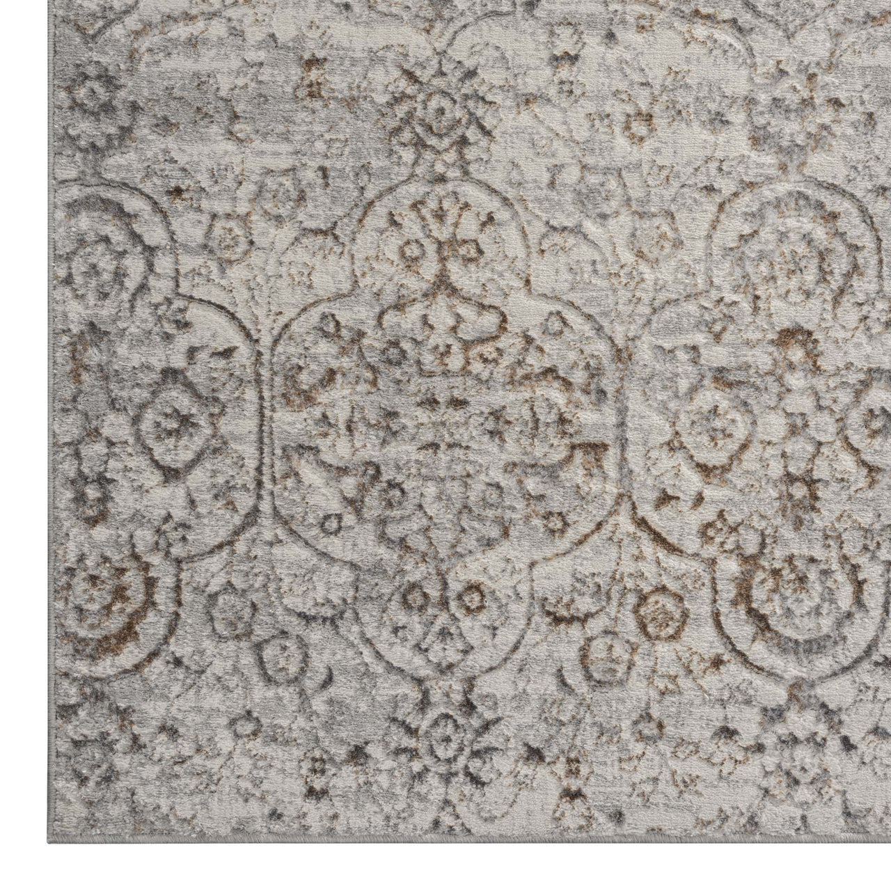 Grey beige modern rug with subtle multi-colour distressed floral pattern, soft polyester texture.