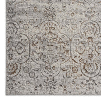 Grey beige modern rug with subtle multi-colour distressed floral pattern, soft polyester texture.