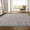 Grey beige multi-color patterned modern power-loomed polyester rug on wooden floor.