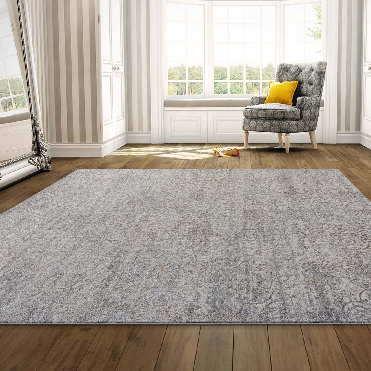 Grey beige multi-color patterned modern power-loomed polyester rug on wooden floor.