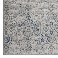 Grey and blue patterned modern rectangular rug with intricate medallion design.