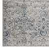 Grey blue runner rug with intricate multi-color abstract floral pattern and textured pile.
