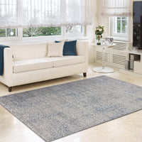 Grey-blue rug with intricate multi-color geometric and floral patterns on a flatwoven polyester surface.