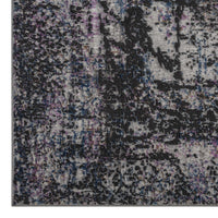 Grey multi-color patterned modern rug with abstract geometric shapes and textured look.