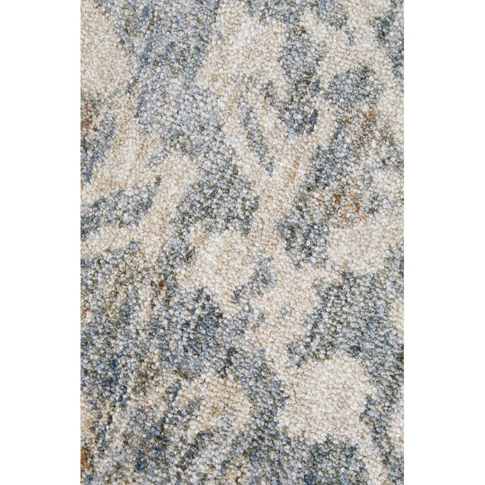 Textured patterned rug with neutral tones.